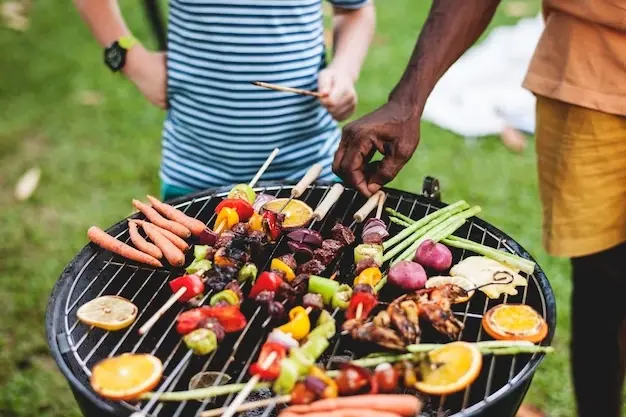 diverse-people-enjoying-barbecue-party-together_53876-10394